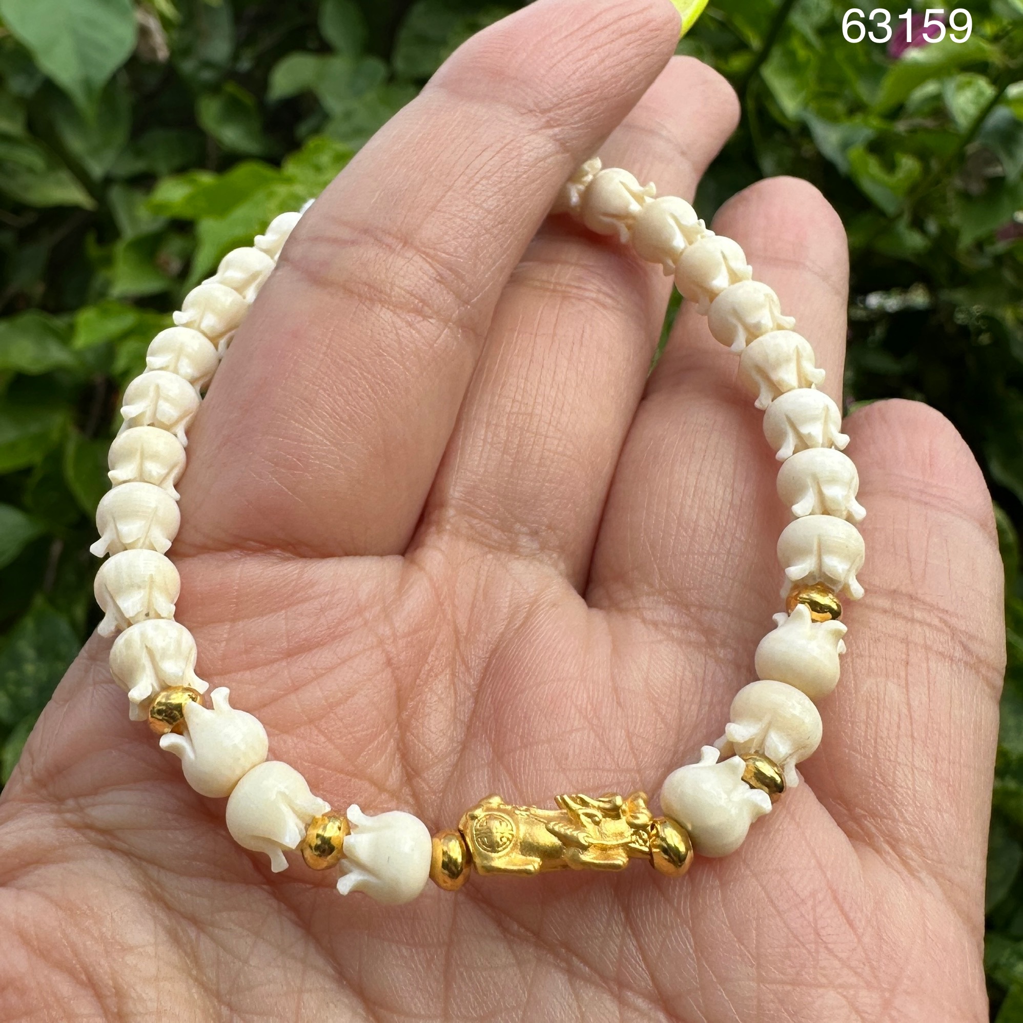 รหัส 63159 สร้อยข้อมือ ปี่เซียะ ทอง99.99 คั่นทอง90 เม็ดประคำ ความยาว 18.00 ซม. ร้อยด้วยเอ็น นน. 5.27 g