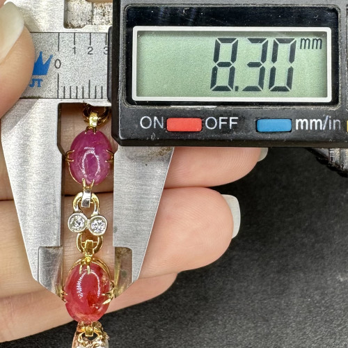 รหัส 63469 สร้อยข้อมือ ทับทิม หลังเบี้ย คั่นเพชรเกสร 16/0.72 ct ทองK 2 สี ความยาว 17.00 ซม. นน. 13.39 g