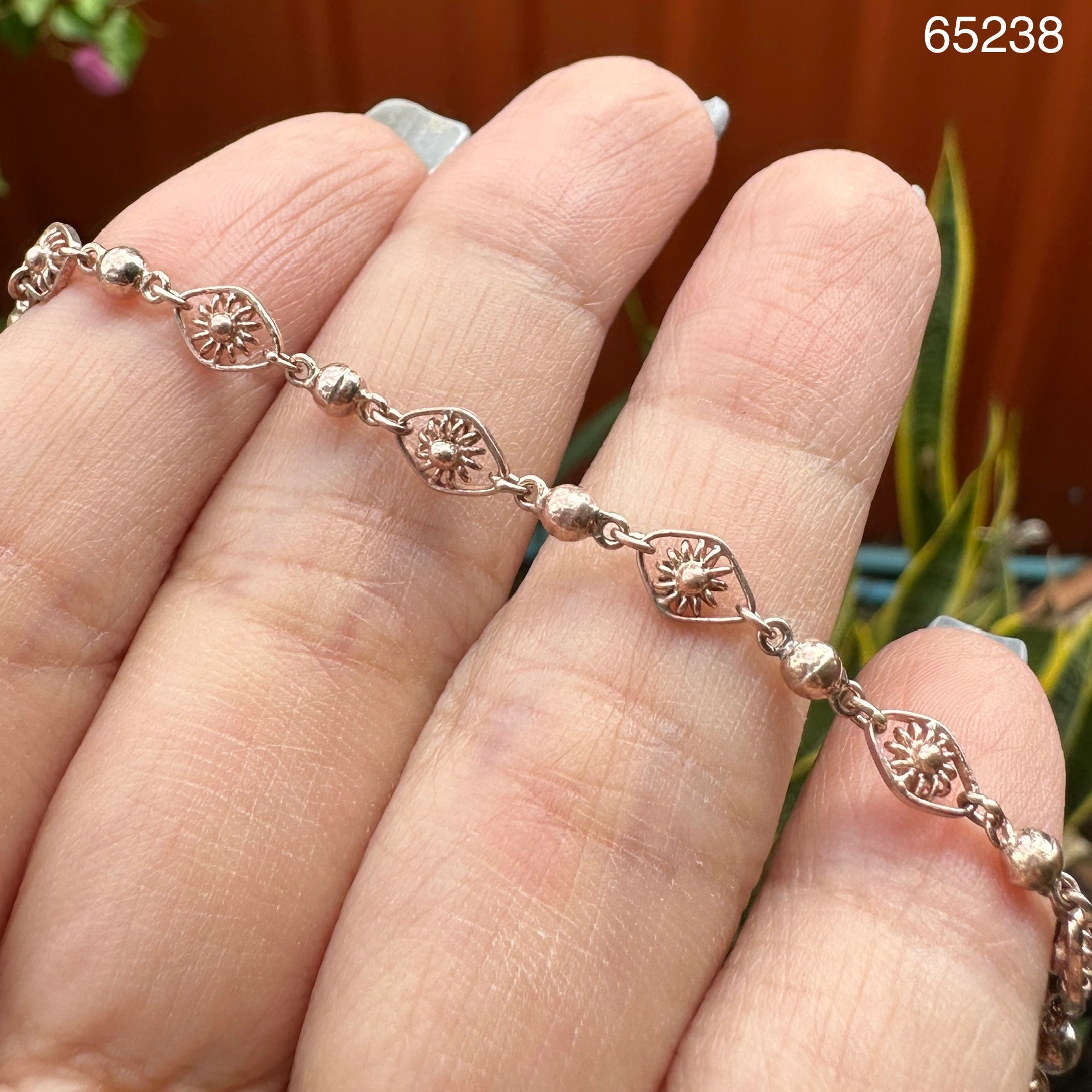 รหัส 65238 สร้อยข้อมือ นาก40 ลายดวงตา คั่นเม็ดกลม รอบเส้น กระดิ่ง ตุ้งติ้ง ความยาว 17.50 ซม. นน. 3.68 g