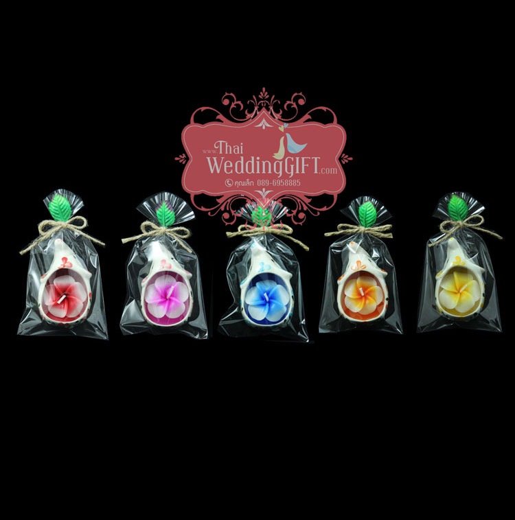 เทียนหอมดอกลีลาวดีบรรจุในเซรามิครูปช้าง แพ็คถุงแก้ว ผูกเชือกพร้อมใบไม้