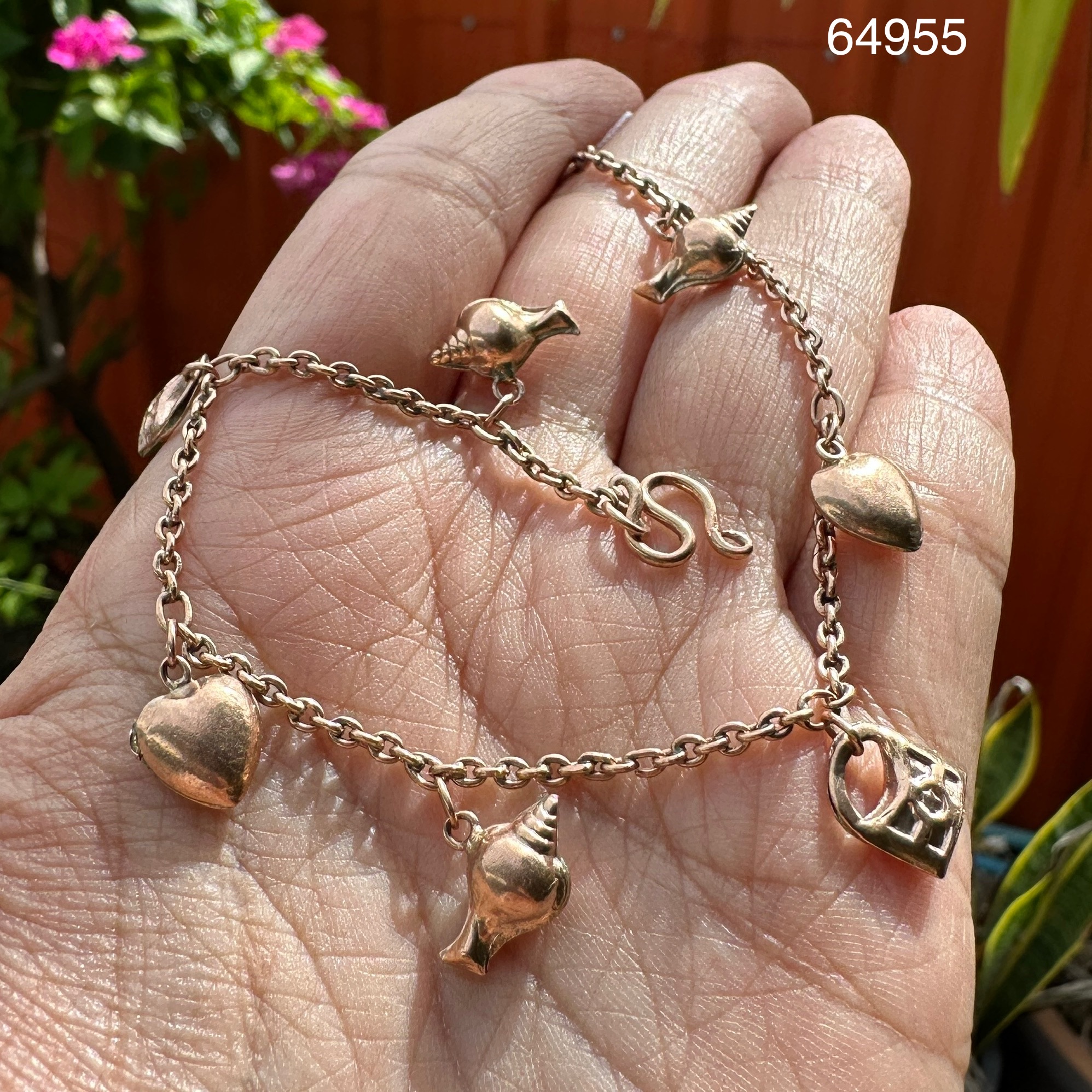 รหัส 64955 สร้อยข้อมือ นาก40 ตุ้งติ้ง หอยสังข์ แม่กุญแจ หัวใจ รอบเส้น ความยาว 19.00 ซม. นน. 7.27 g
