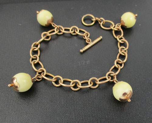 รหัส 57210 สร้อยข้อมือ นาก40 เม็ดกลม กระพรวน ตุ้งติ้ง หลุดจำนำ นน. 13.58 g