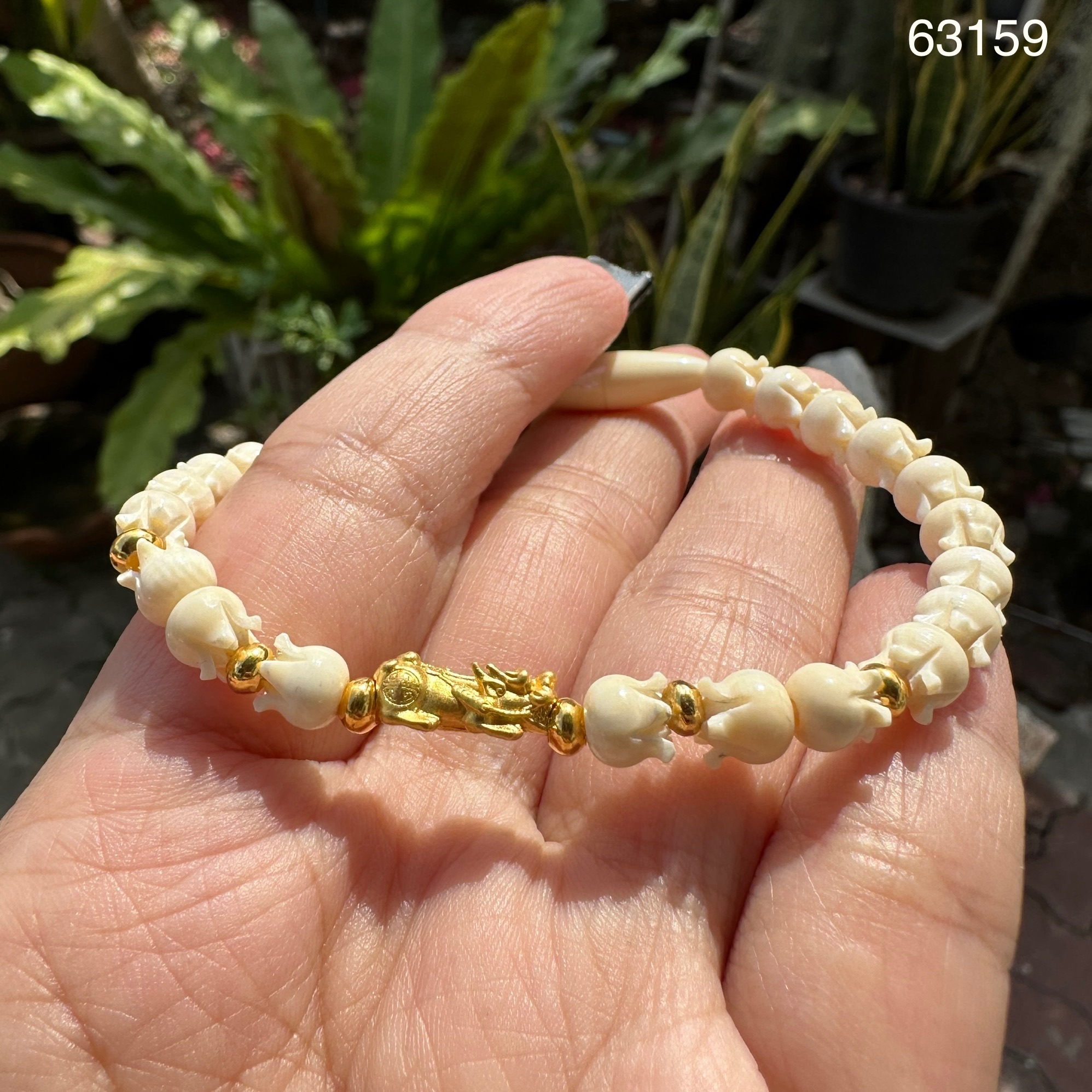 รหัส 63159 สร้อยข้อมือ ปี่เซียะ ทอง99.99 คั่นทอง90 เม็ดประคำ ความยาว 18.00 ซม. ร้อยด้วยเอ็น นน. 5.27 g