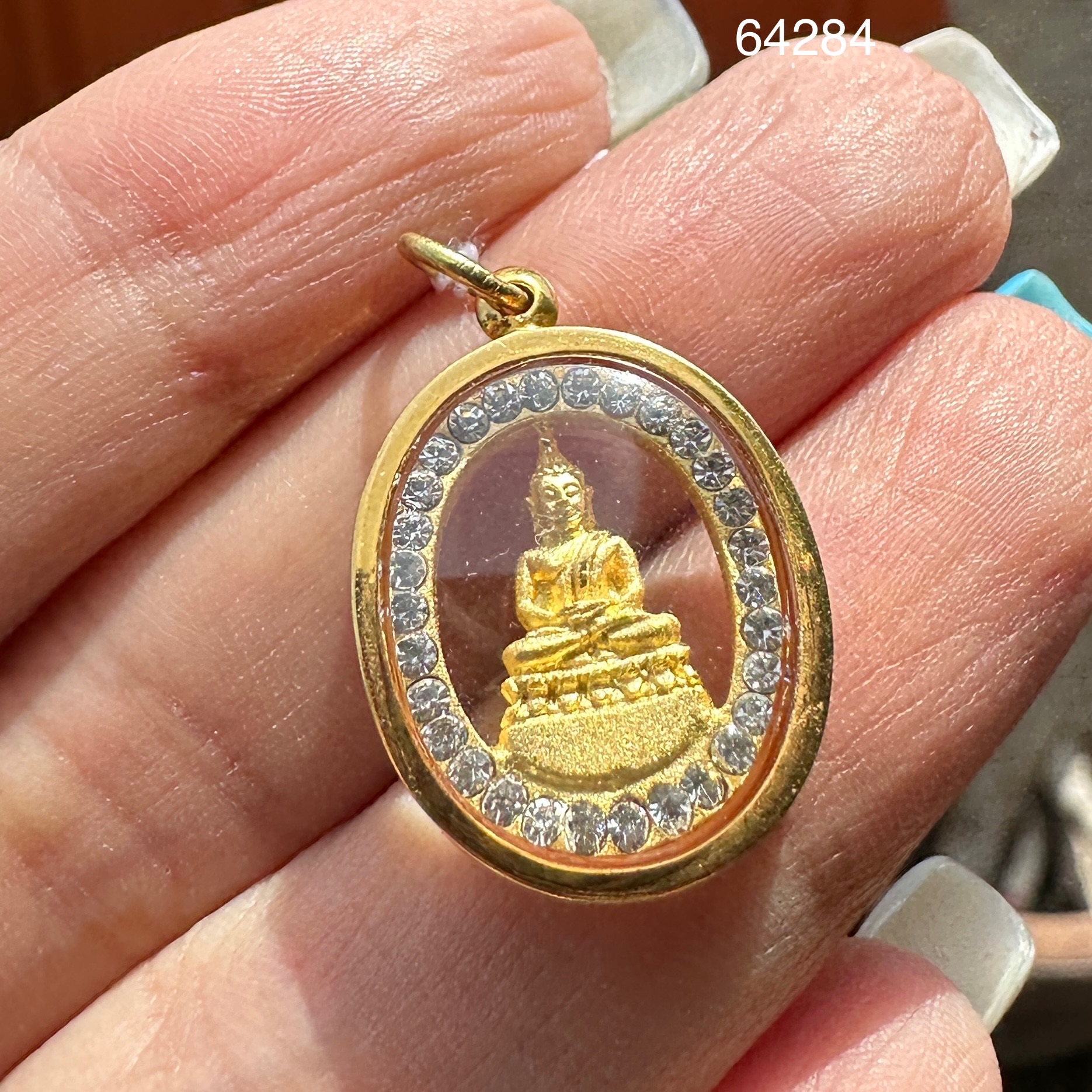 รหัส 64284 พระปางสมาธิ ประจำวันพฤหัสบดี ล้อมพลอยขาว กะไหล่ทอง เลี่ยมทอง75%นน. 3.03 g
