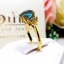 แหวนเพทาย Blue Zircon สีฟ้าสด เล่นลูกเล่นลายไทยทรงดอกประดับฝังด้วยเพชรแท้ บนตัวเรือนทองแท้ทั้งตัวเรือน