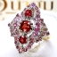 แหวนทับทิม Ruby สีแดงสดเรียงแถวสามเม็ด ประดับตกแต่งด้วย Pink Sapphire ตัวเรือนทรงไทยชุบทองคำขาว บนตัวเรือนทองแท้ทั้งตัวเรือน
