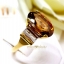 แหวนเพทายดิบสีแชมเปญ Champagne Zircon ประดับตกแต่งด้วยเพชรแท้บ่าข้าง บนตัวเรือนทองแท้ทั้งตัวเรือน