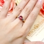 แหวนพลอยทับทิม Ruby สีเลือดนก ทรงหวานประดับตกแต่งด้วยเพชรแท้เป็นทรงใบไม้ไขว้ลายไทย บนตัวเรือนทองแท้ทั้งตัวเรือน