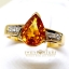 แหวนพลอยบุษราคัม Yellow Sapphire ฝังทรงหยกน้ำ ตกแต่งเพชรแท้ที่บ่าข้าง ดูเรียบหรู บนตัวเรือนทองแท้ทั้งตัวเรือน