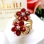 แหวนทับทิม Ruby สีแดงสด เรียงร้อยเป็นทรงดอกไม้ อ่อนหวาน ประดับฝังด้วยเพชรแท้น้ำงาม บนตัวเรือนทองแท้ทั้งตัวเรือน