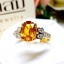 แหวนบุษราคัม Yellow Sapphire เล่นลูกเล่นลายไทยทรงดอกประดับฝังด้วยเพชรแท้ บนตัวเรือนทองแท้ทั้งตัวเรือน