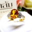 แหวนบุษราคัม Yellow Sapphire เล่นลูกเล่นลายไทยทรงดอกประดับฝังด้วยเพชรแท้ บนตัวเรือนทองแท้ทั้งตัวเรือน
